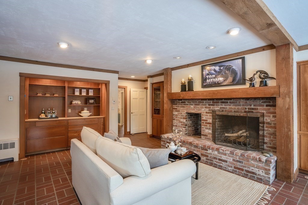 2 Sudbury Road Weston, MA 02493 - Photo 20 of 42 a living room with furniture and a fireplace