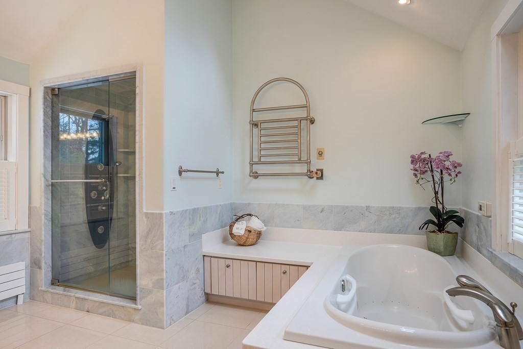 2 Sudbury Road Weston, MA 02493 - Photo 23 of 42 a bathroom with a tub sink and vanity