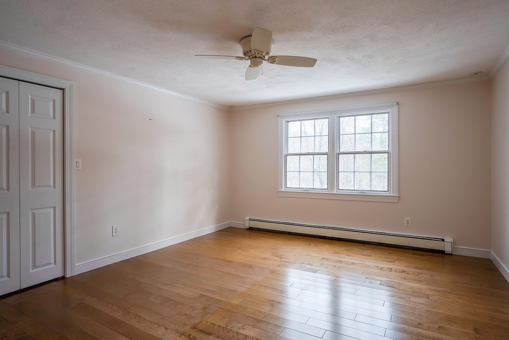 2 Sudbury Road Weston, MA 02493 - Photo 26 of 42 an empty room with wooden floor and windows