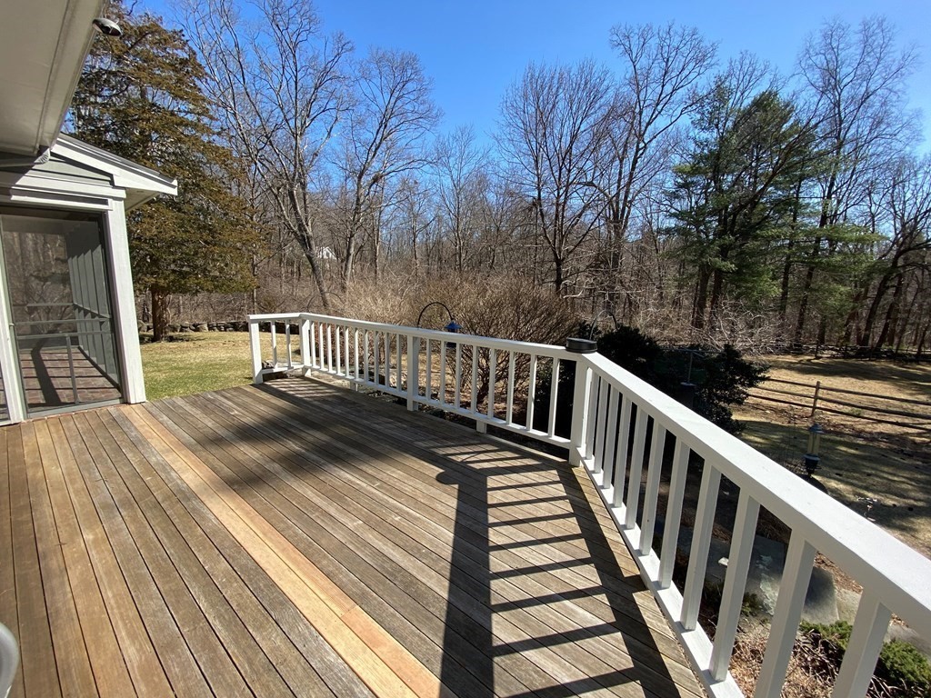 2 Sudbury Road Weston, MA 02493 - Photo 31 of 42 a view of balcony with wooden floor and fence