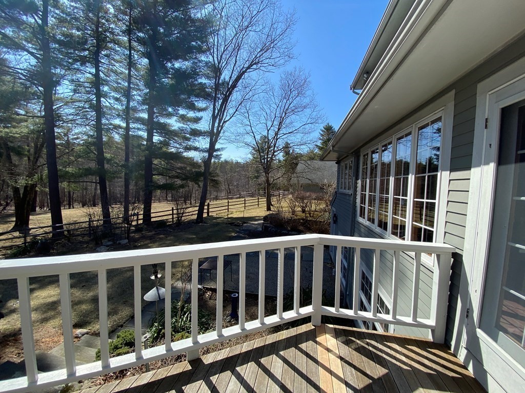2 Sudbury Road Weston, MA 02493 - Photo 32 of 42 a view of balcony with wooden floor and fence
