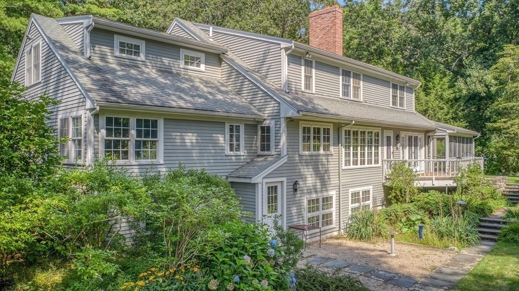 2 Sudbury Road Weston, MA 02493 - Photo 5 of 42 a front view of a house with a garden