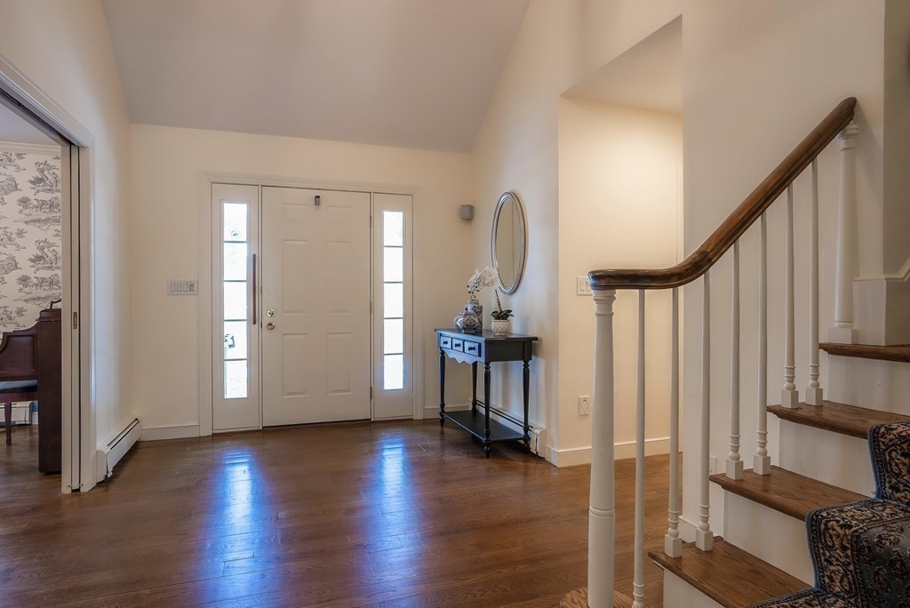 2 Sudbury Road Weston, MA 02493 - Photo 9 of 42 a view of an entryway with wooden floor and staircase