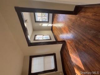 3 Dean Place Poughkeepsie, NY 12601 - Photo 4 of 10 Empty room featuring dark wood finished floors and baseboards