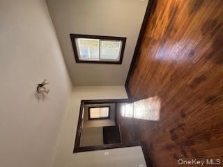 3 Dean Place Poughkeepsie, NY 12601 - Photo 5 of 10 Unfurnished room featuring dark wood finished floors and plenty of natural light