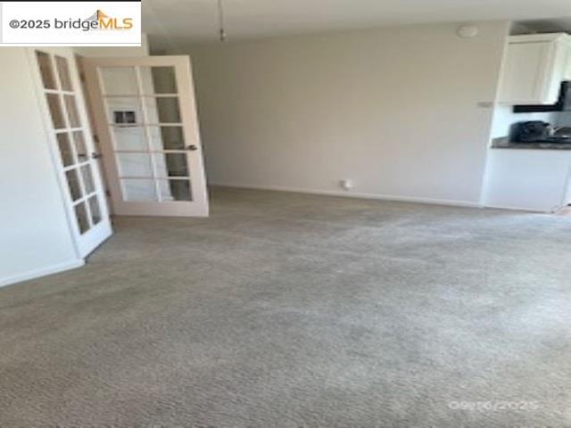 455 Crescent Street, Unit 312 Oakland, CA 94610 - Photo 3 of 5 a view of an empty room with a window