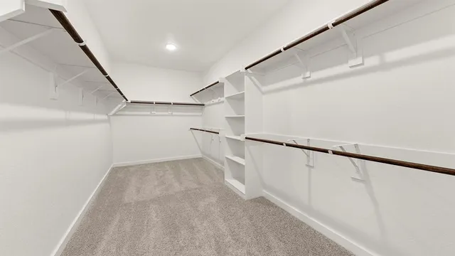 a view of an empty walk in closet