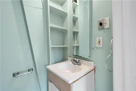 a bathroom with a sink and mirror