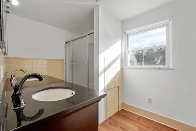 a bathroom with a sink and a mirror