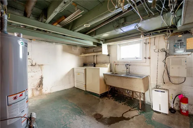 a utility room with cabinets dryer and washer