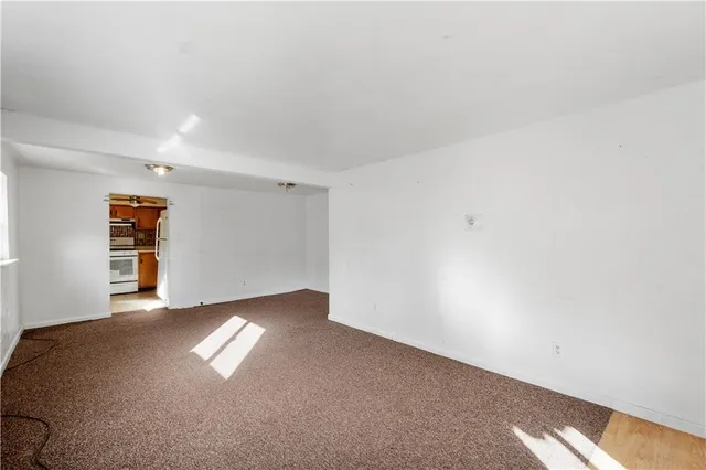 a view of an empty room and window