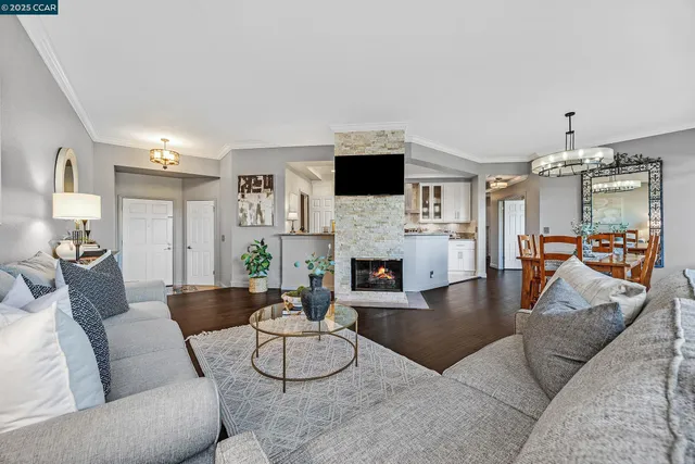 a living room with furniture fireplace and a flat screen tv