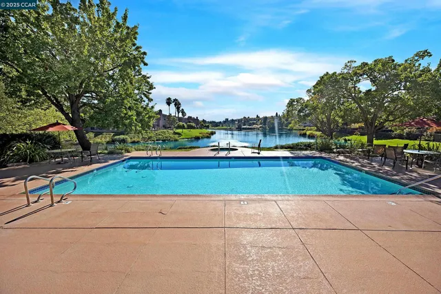 a view of swimming pool with a yard