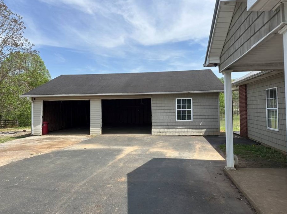 1561 Hickory Valley Road Sparta, TN 38583 - Photo 18 of 20 a front view of a house with a yard and garage
