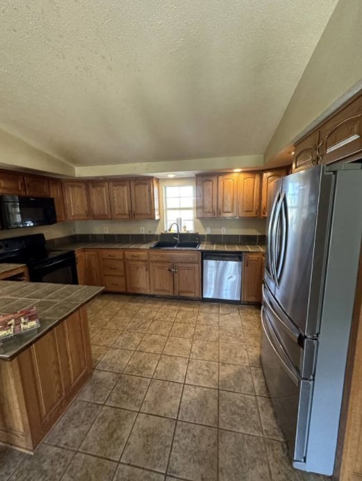 1561 Hickory Valley Road Sparta, TN 38583 - Photo 2 of 20 a kitchen with stainless steel appliances granite countertop a refrigerator and a stove top oven