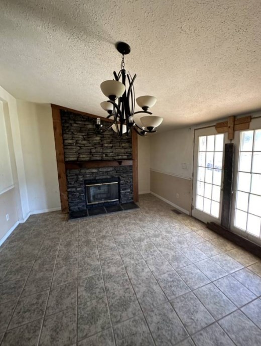1561 Hickory Valley Road Sparta, TN 38583 - Photo 5 of 20 a view of a livingroom with a projector and a chandelier