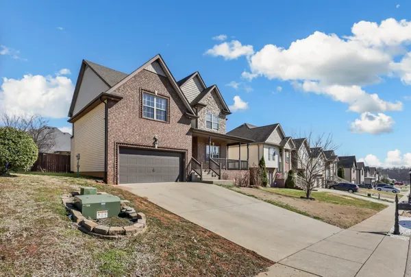 a front view of a house with a yard