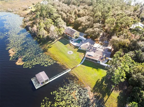 an aerial view of a house with a swimming pool