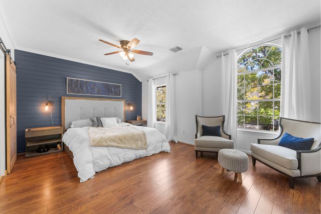 a living room with furniture and windows