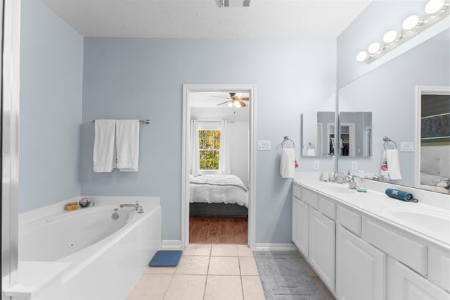 a bathroom with a tub and shower
