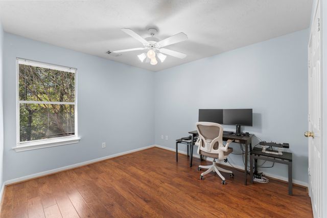 a bathroom with a sink a toilet and shower curtain