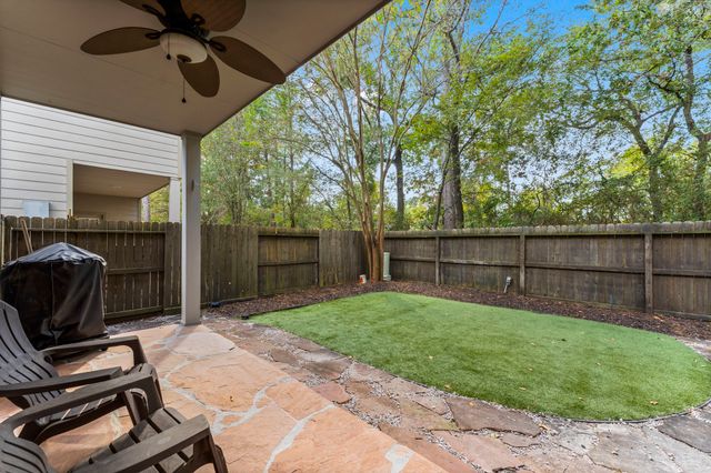 a view of a house with backyard porch and sitting area