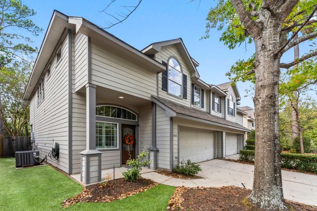 a front view of a house with a yard and porch