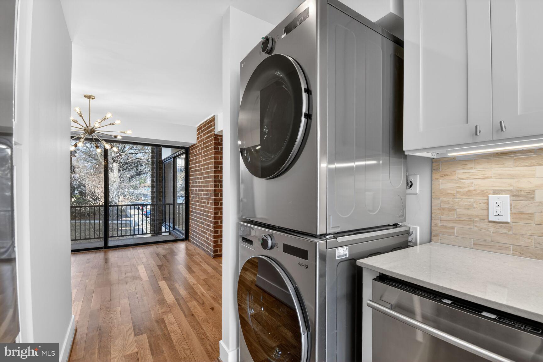 9802 Georgia Avenue, Unit 26202 Silver Spring, MD 20902 - Photo 13 of 31 a view of a storage and utility room with washer and dryer