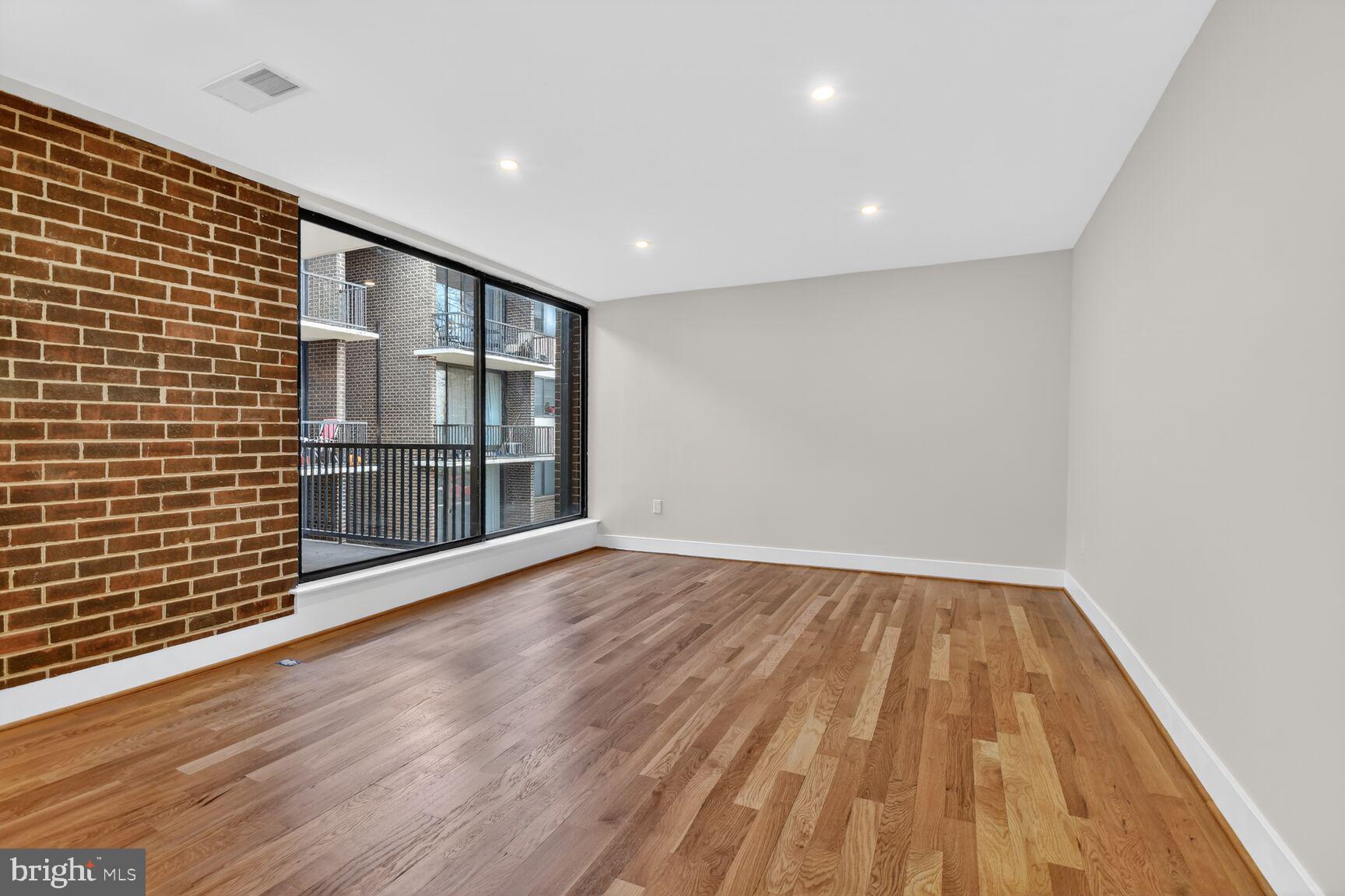 9802 Georgia Avenue, Unit 26202 Silver Spring, MD 20902 - Photo 16 of 31 a view of livingroom with wooden floor