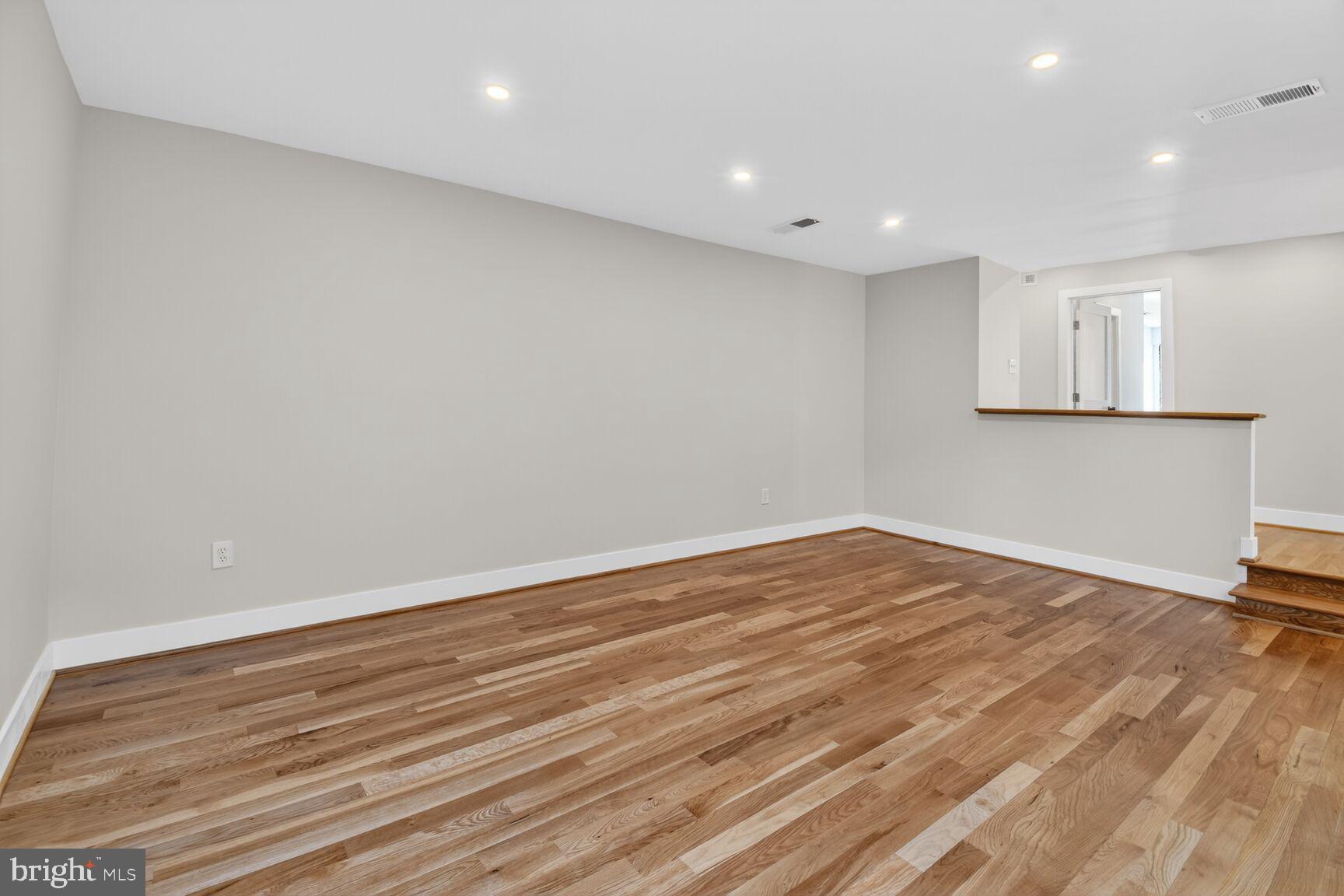 9802 Georgia Avenue, Unit 26202 Silver Spring, MD 20902 - Photo 19 of 31 a view of empty room with wooden floor