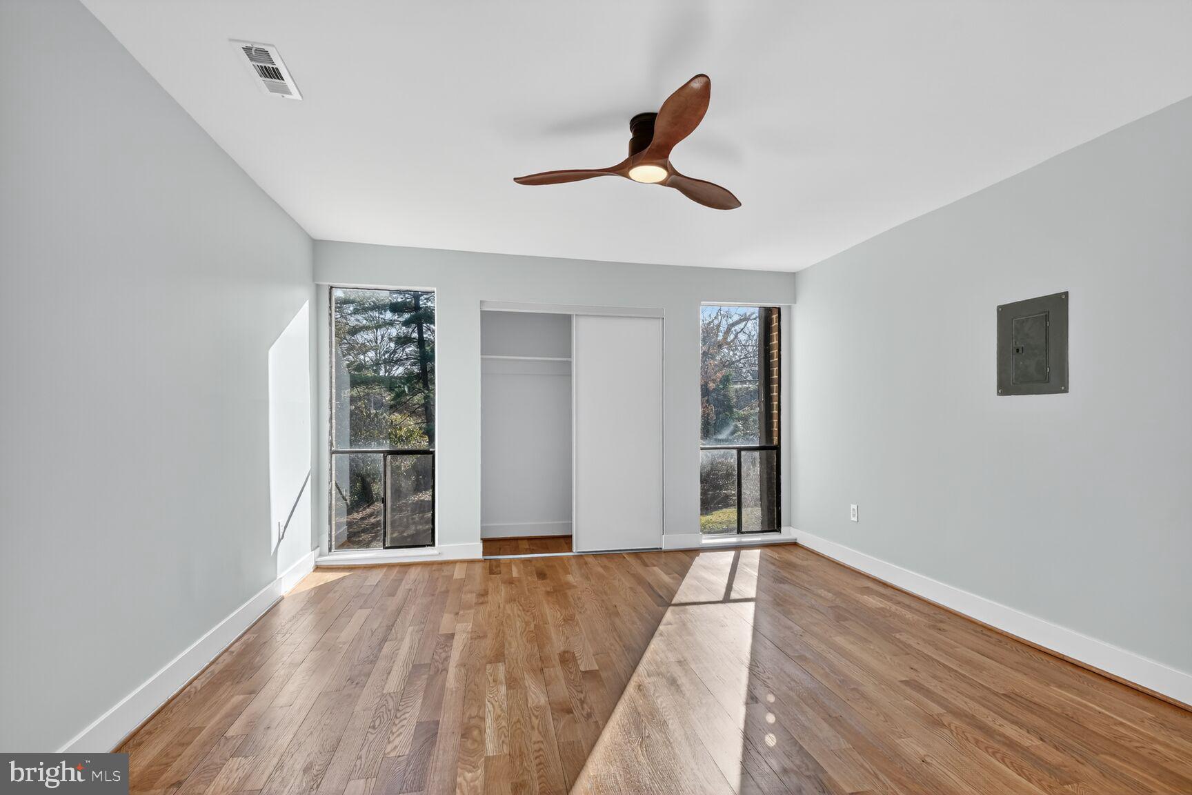 9802 Georgia Avenue, Unit 26202 Silver Spring, MD 20902 - Photo 20 of 31 a view of empty room with wooden floor and window