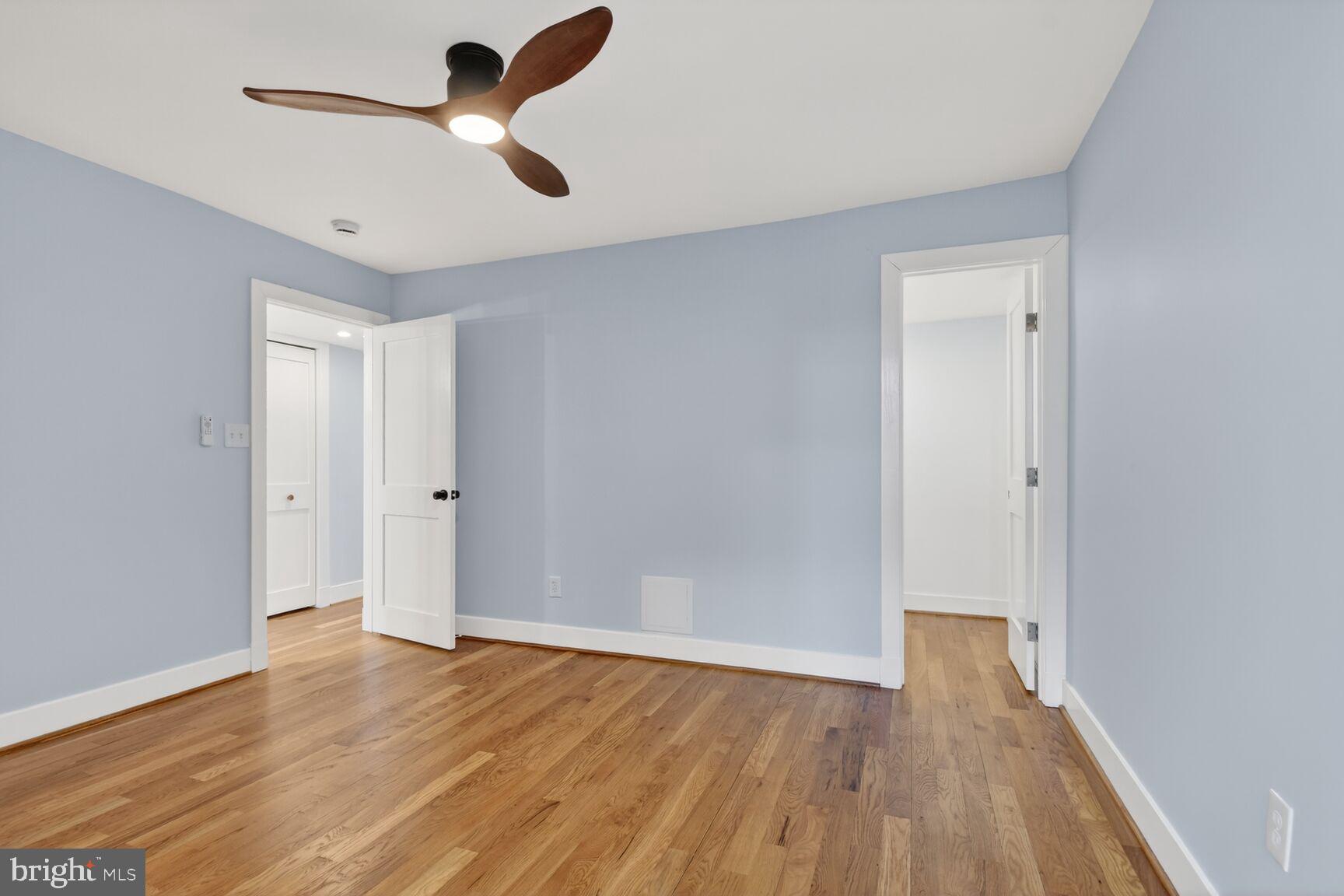 9802 Georgia Avenue, Unit 26202 Silver Spring, MD 20902 - Photo 26 of 31 wooden floor in an empty room