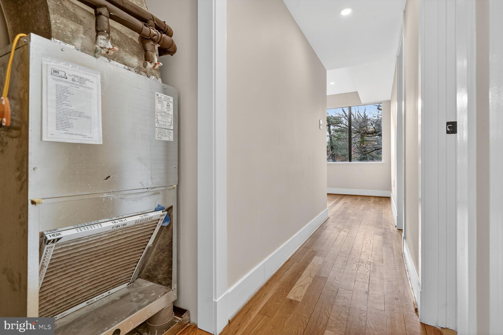 9802 Georgia Avenue, Unit 26202 Silver Spring, MD 20902 - Photo 31 of 31 a view of hallway with wooden floor