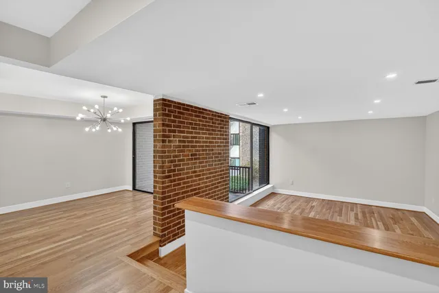 a view of livingroom with hardwood floor and ceiling fan