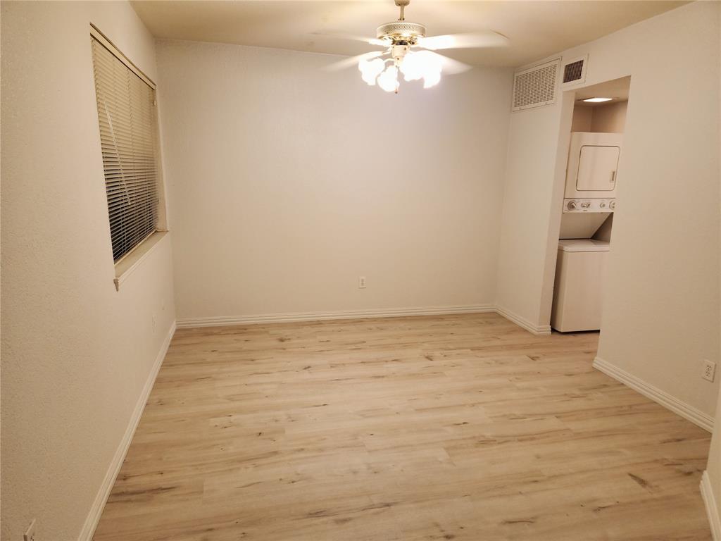 9813 Walnut Street, Unit 104 Dallas, TX 75243 - Photo 12 of 19 a view of an empty room with a fan