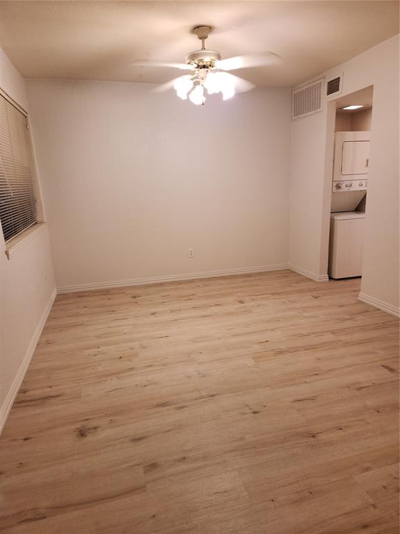 9813 Walnut Street, Unit 104 Dallas, TX 75243 - Photo 13 of 19 wooden floor in an empty room