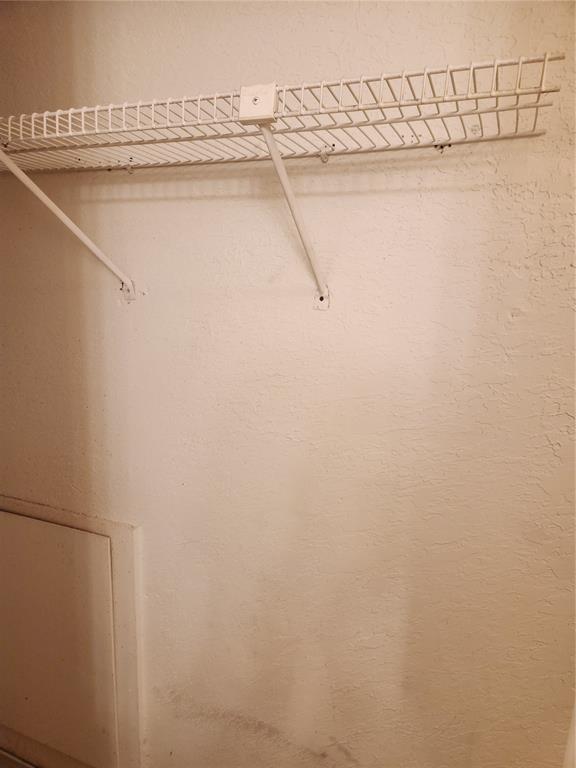 9813 Walnut Street, Unit 104 Dallas, TX 75243 - Photo 17 of 19 a view of a rack on the wall
