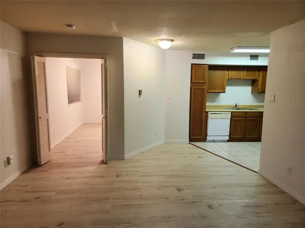 a view of a kitchen with a sink and a stove top oven