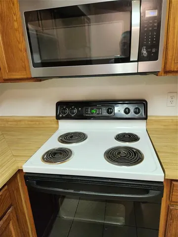 a kitchen with a stove and a microwave
