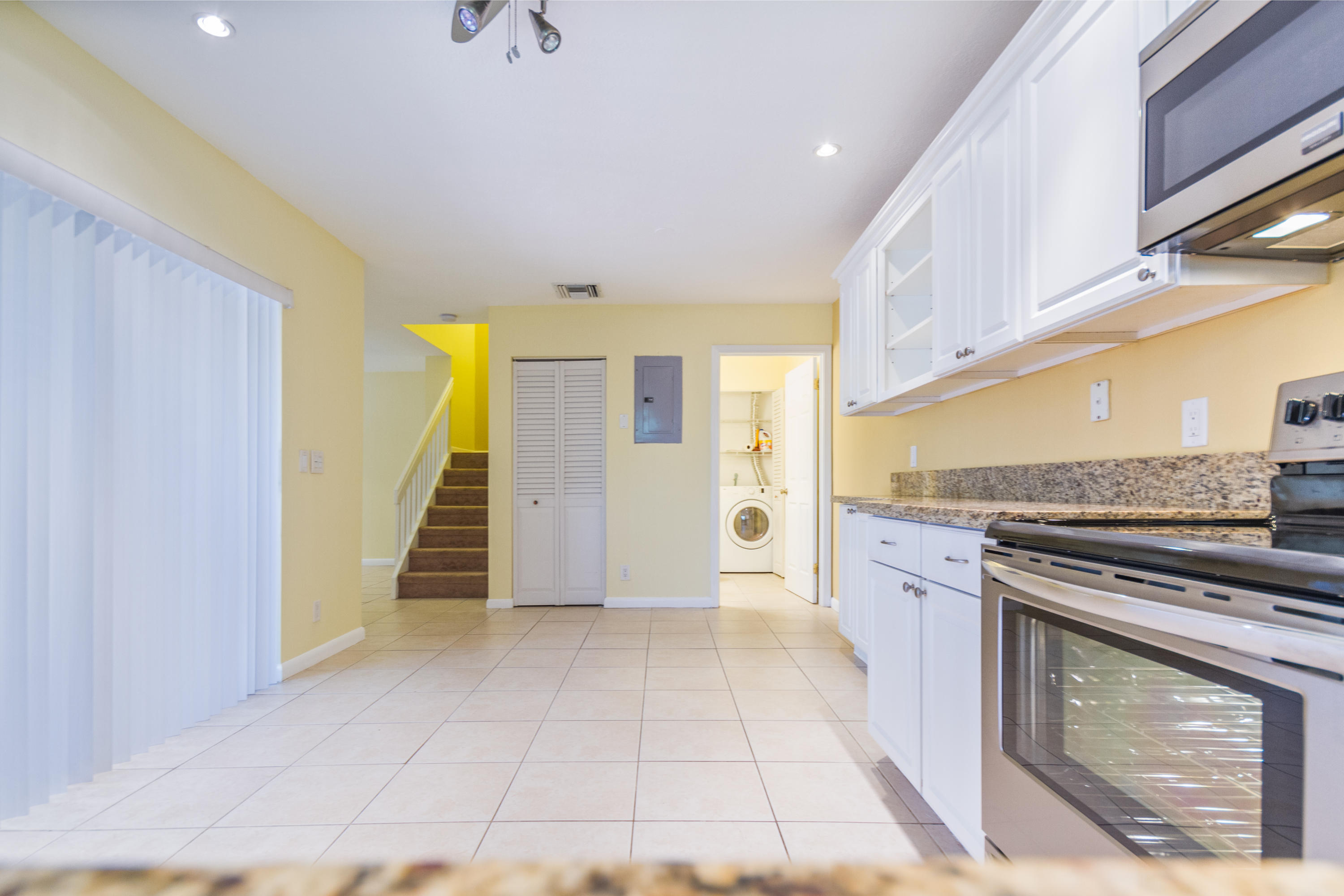 7738 Courtyard Run West Boca Raton, FL 33433 - Photo 7 of 19 5 - Kitchen to bathroom laundry