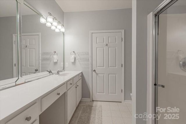a bathroom with a sink double vanity and a mirror
