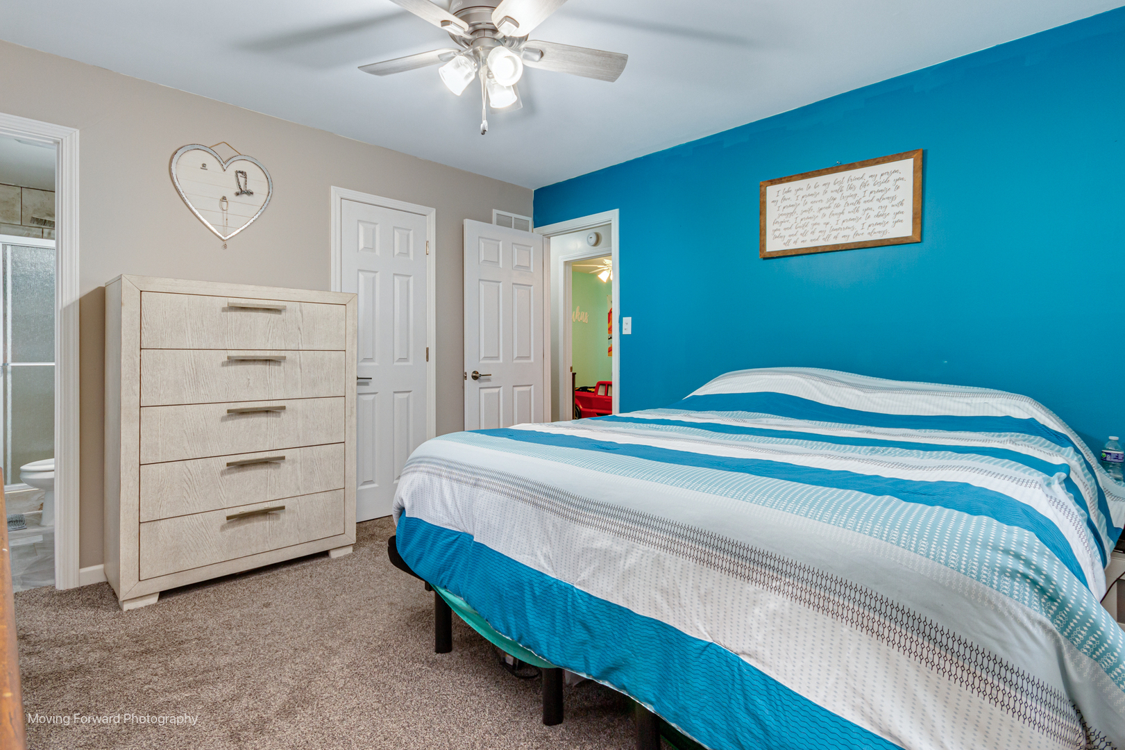 305 Prospect Avenue Dwight, IL 60420 - Photo 17 of 27 a bedroom with a bed and a chandelier