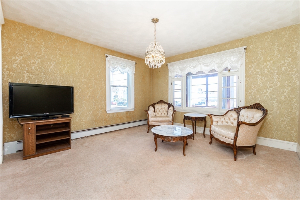 2 Sheldon Road Peabody, MA 01960 - Photo 11 of 42 a living room with furniture and a flat screen tv