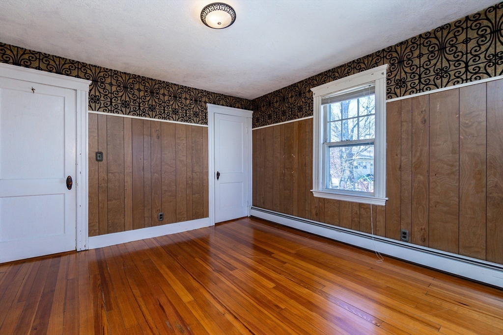 2 Sheldon Road Peabody, MA 01960 - Photo 18 of 42 a view of an empty room with wooden floor and a window