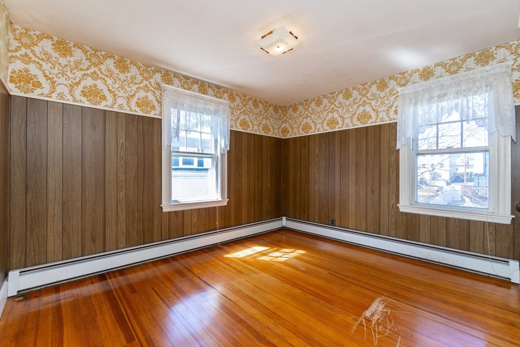 2 Sheldon Road Peabody, MA 01960 - Photo 19 of 42 a view of an empty room with window and wooden floor