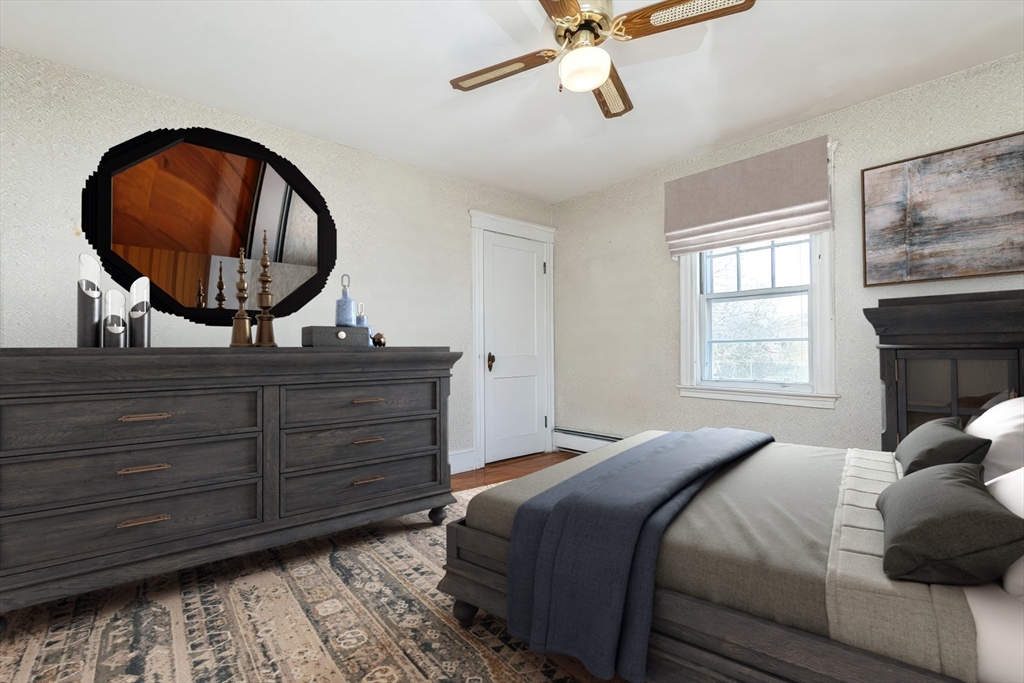 2 Sheldon Road Peabody, MA 01960 - Photo 21 of 42 a bedroom with a bed and a mirror
