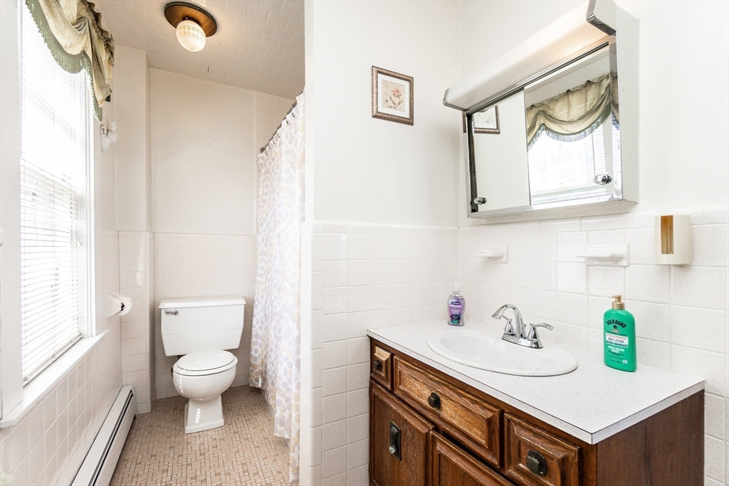 2 Sheldon Road Peabody, MA 01960 - Photo 24 of 42 a bathroom with a sink a toilet and a window