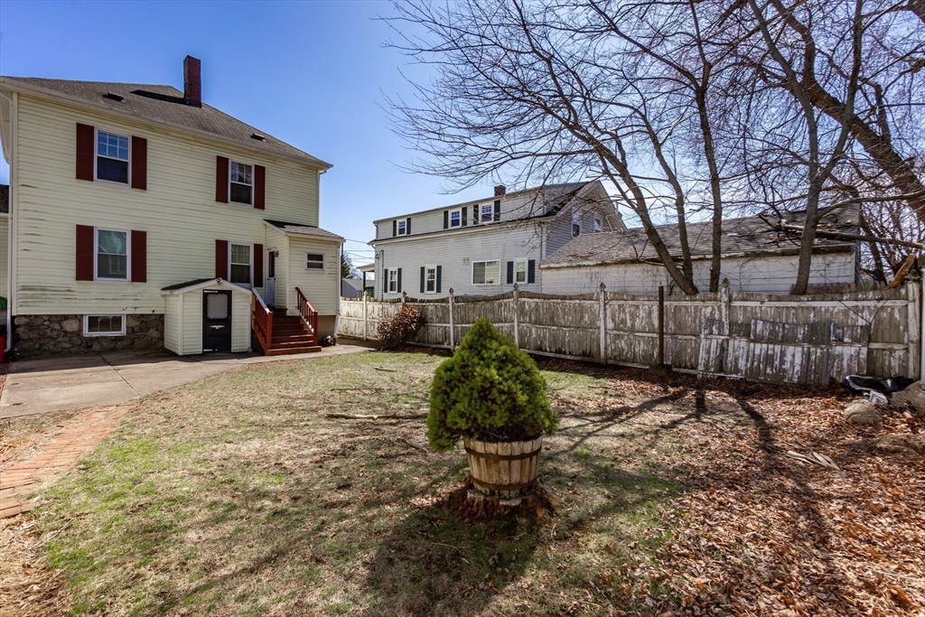 2 Sheldon Road Peabody, MA 01960 - Photo 33 of 42 a backyard of a house with barbeque oven and outdoor seating