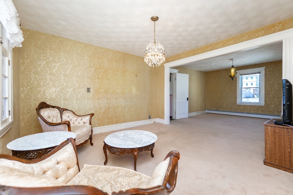 2 Sheldon Road Peabody, MA 01960 - Photo 10 of 42 a view of a livingroom with furniture window and wooden floor