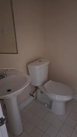 an empty room with a mirror